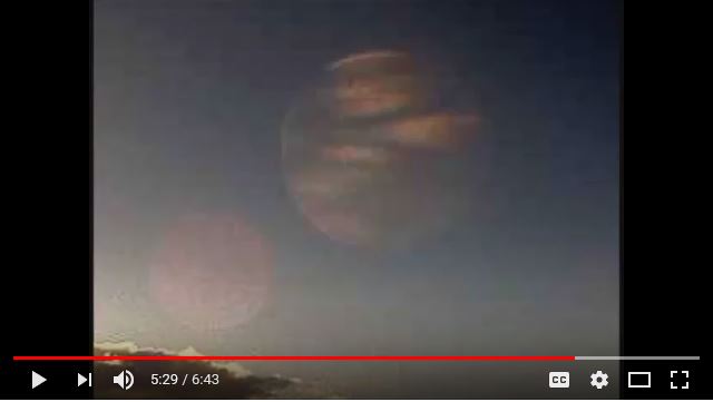 Capture -- Twenty-second picture showing 2 striped planets from Toque, Alaska