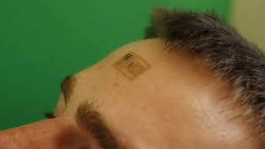 images -- epidermal tattoo on a persons forehead