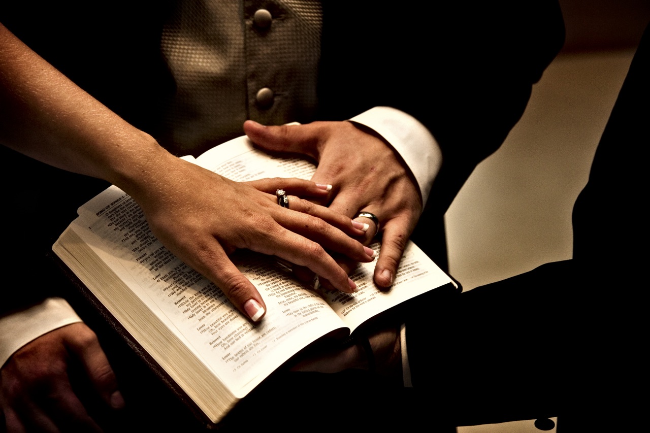Wedding-rings-hands-on-bible