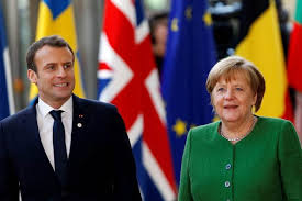 France's Emanuel Macron and Germany's Angela Merkel