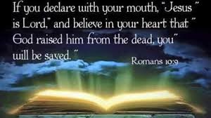An Open Bible with Romans 10 verse 9 above the Bible