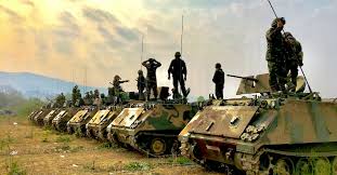 During the Millenium No Military or Weapons of War -- Tanks lined up in a row