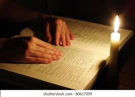 Shutterstock -- Praying Hands On Open Bible Stock Photo