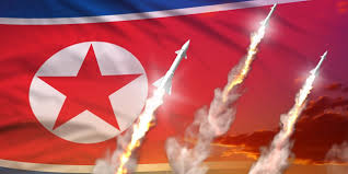 7.) D.) Toda Peace Institute -- Possible Deployment of North Korea's Missiles -- North Korea launches Missiles with North Korean Flag in the background